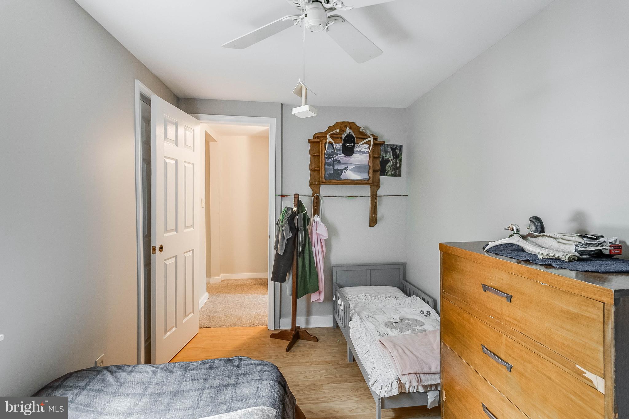 5634 Pearsons Corner Road Dover, DE 19904 - Photo 21 of 40 a bedroom with a bed and a chandelier