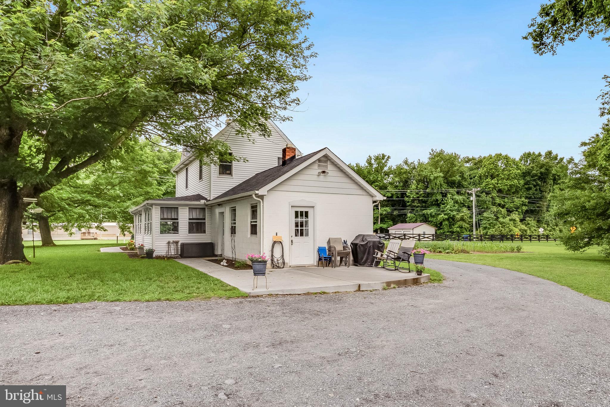 5634 Pearsons Corner Road Dover, DE 19904 - Photo 29 of 40 a view of a house with a yard and large trees