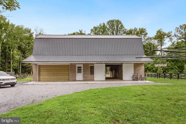 a bedroom with furniture and a baby crib