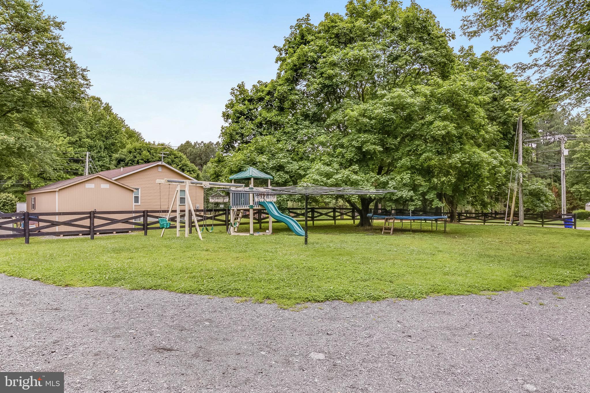 5634 Pearsons Corner Road Dover, DE 19904 - Photo 35 of 40 a view of a house with a yard