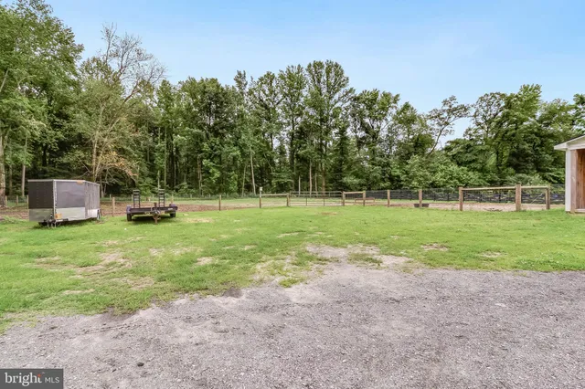 a view of a house with a yard and garage