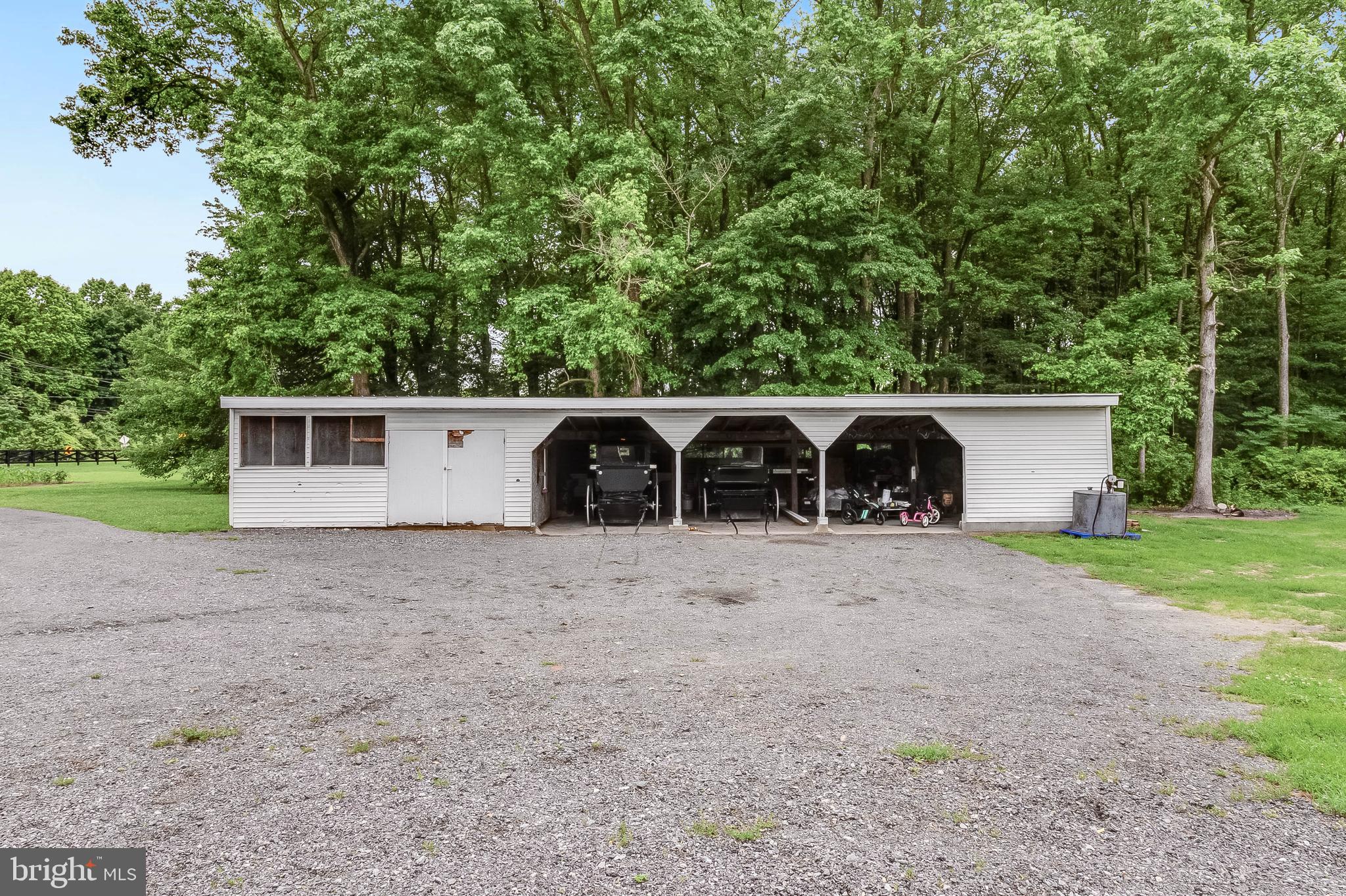 5634 Pearsons Corner Road Dover, DE 19904 - Photo 37 of 40 a view of a house with a yard and garage