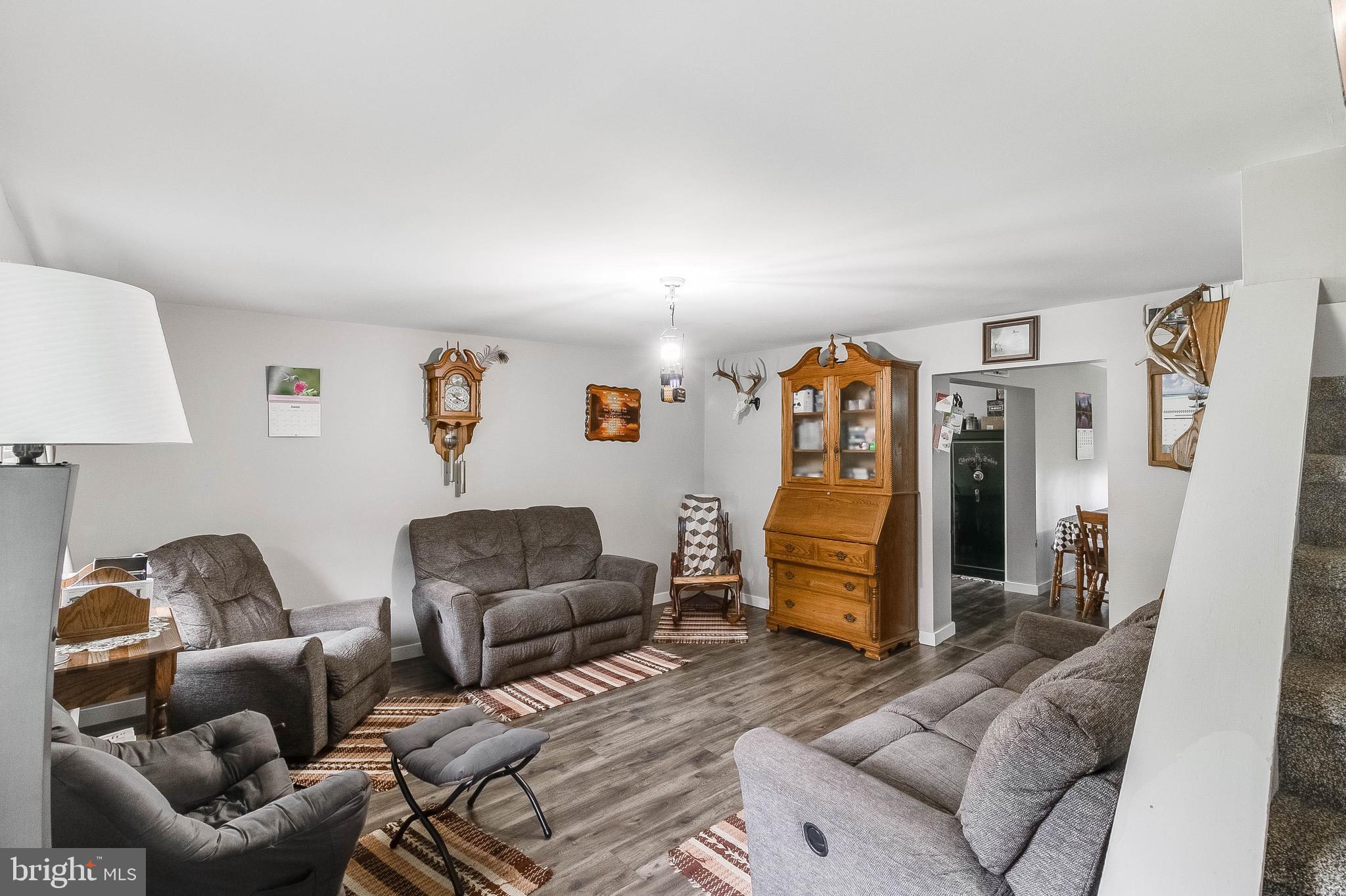 5634 Pearsons Corner Road Dover, DE 19904 - Photo 5 of 40 a living room with furniture and a couch