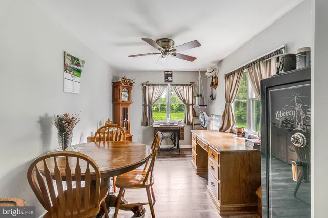 a view of a dining room with furniture window and wooden floor