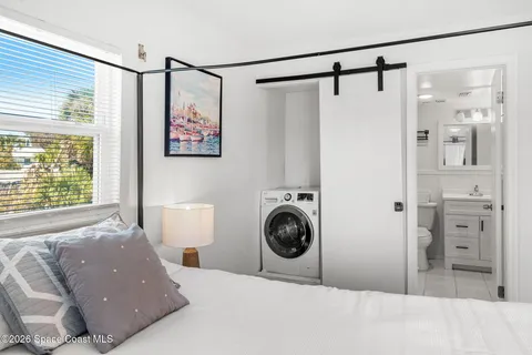 a bed room with a bed and a window