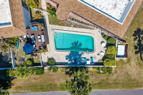 an aerial view of residential house with outdoor space and swimming pool