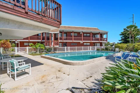 a view of a swimming pool with a lounge chair