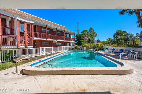 a view of a swimming pool with a patio