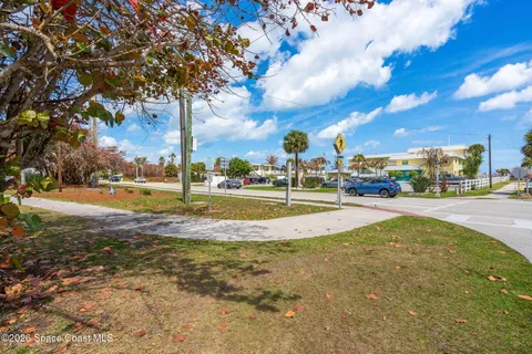 a view of a yard with swimming pool