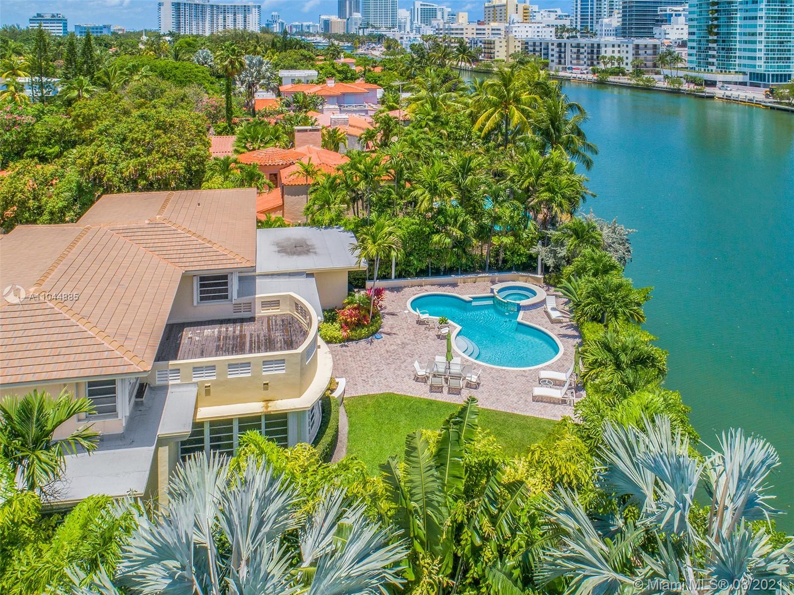 2995 Flamingo Drive Miami Beach, FL 33140 - Photo 2 of 54 an aerial view of a house with a garden and lake view