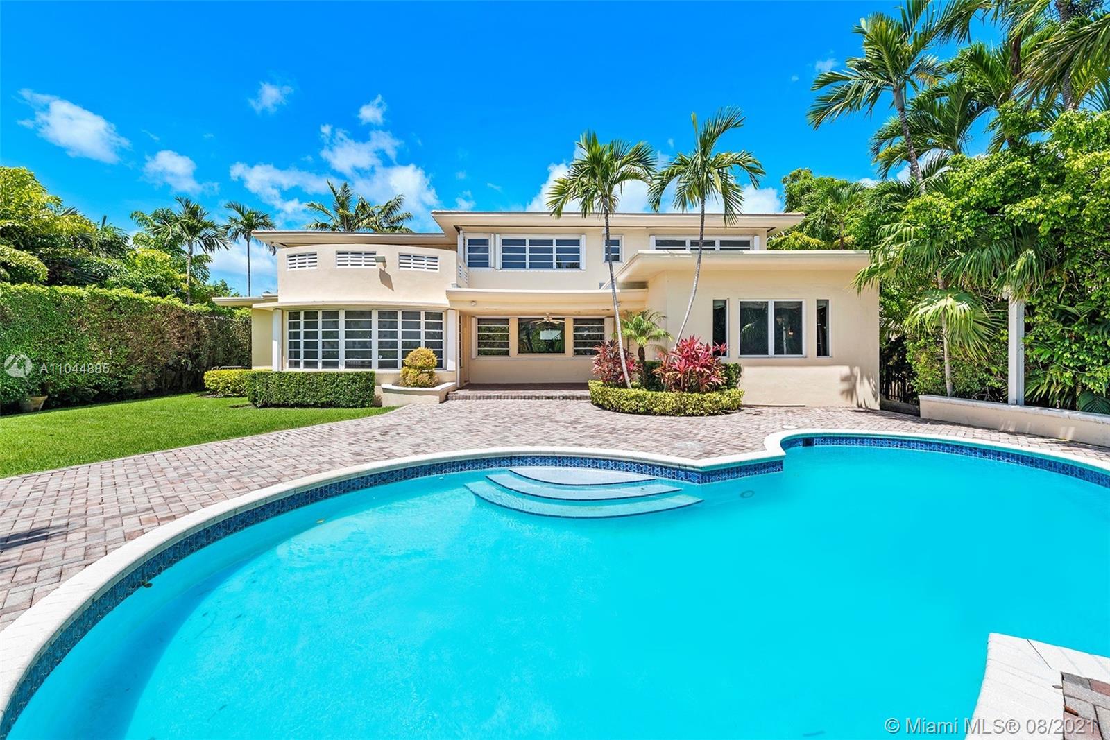 2995 Flamingo Drive Miami Beach, FL 33140 - Photo 13 of 54 a front view of a house with garden
