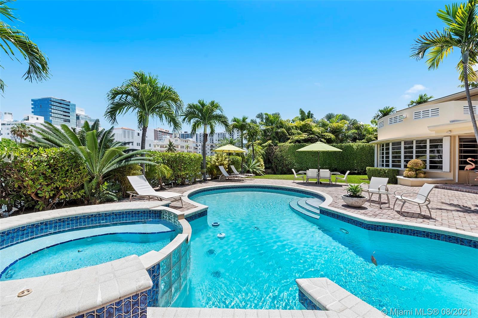 2995 Flamingo Drive Miami Beach, FL 33140 - Photo 15 of 54 a view of a swimming pool with chairs
