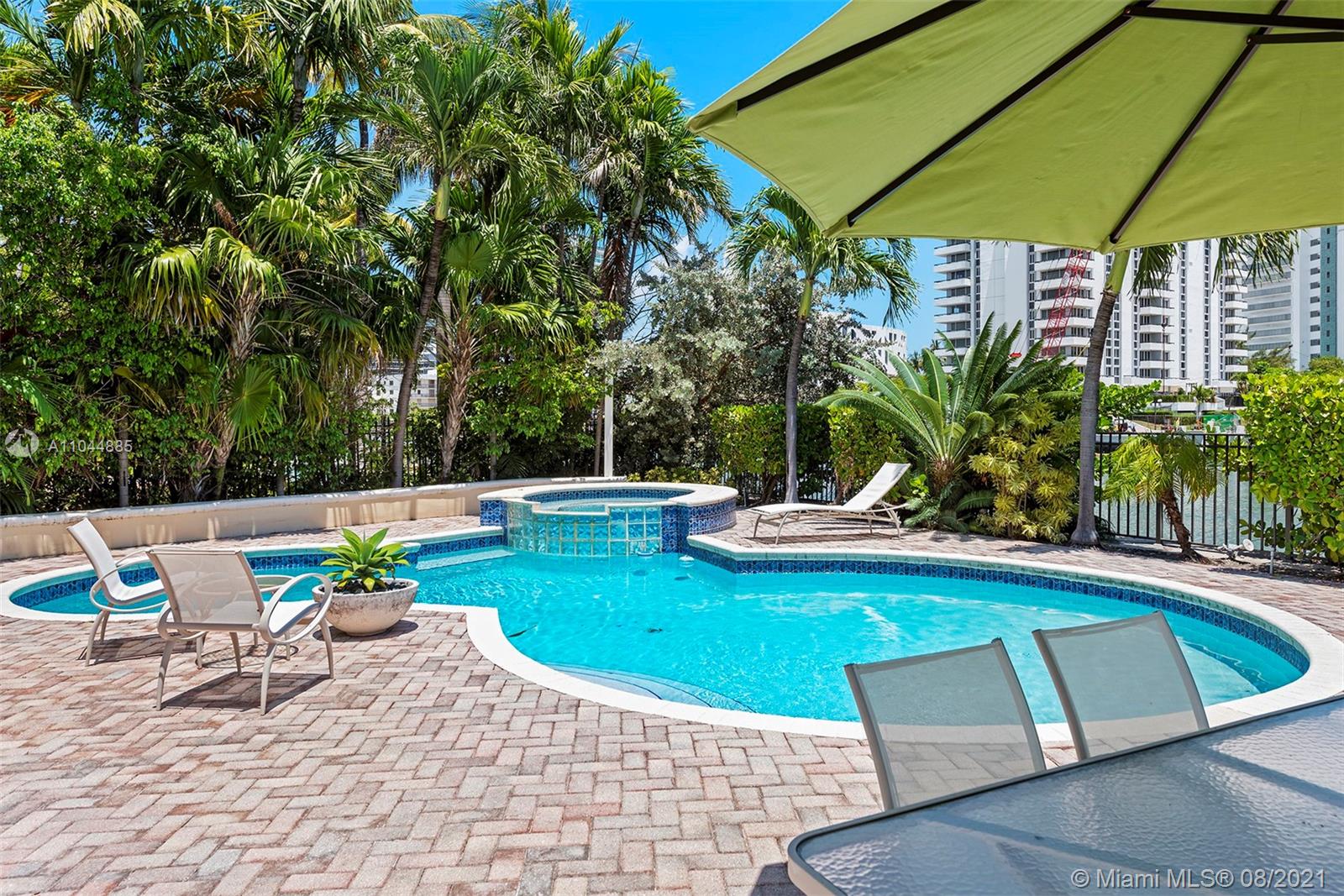 2995 Flamingo Drive Miami Beach, FL 33140 - Photo 16 of 54 a view of a swimming pool with a patio