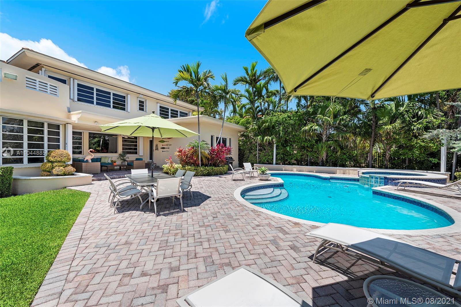 2995 Flamingo Drive Miami Beach, FL 33140 - Photo 17 of 54 a view of a patio with chairs and plants