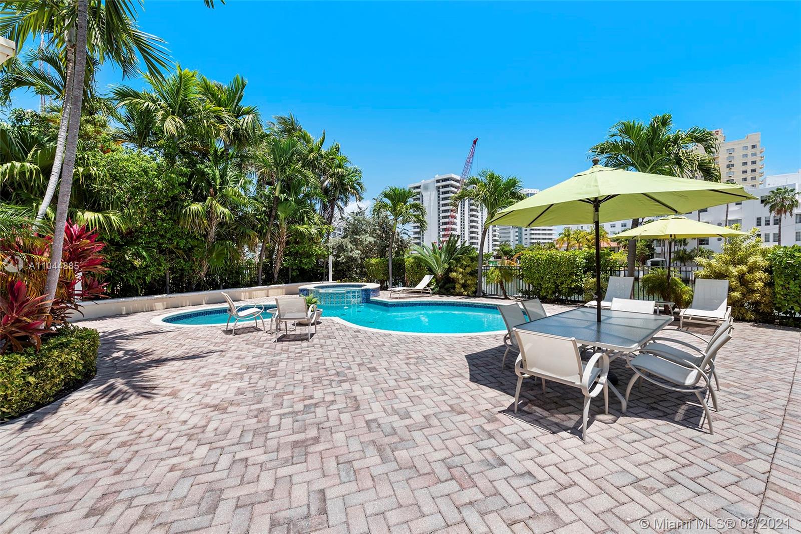 2995 Flamingo Drive Miami Beach, FL 33140 - Photo 21 of 54 a view of a chairs and table in the yard
