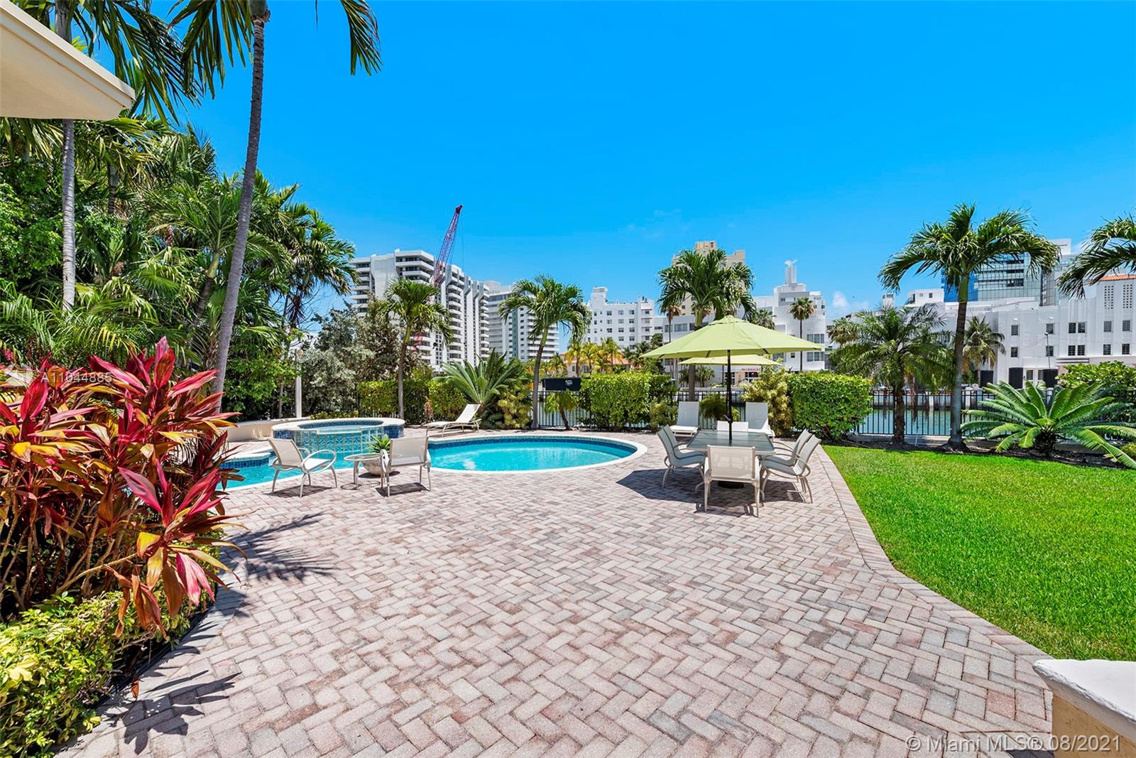 2995 Flamingo Drive Miami Beach, FL 33140 - Photo 22 of 54 a view of a park with a bench and some trees