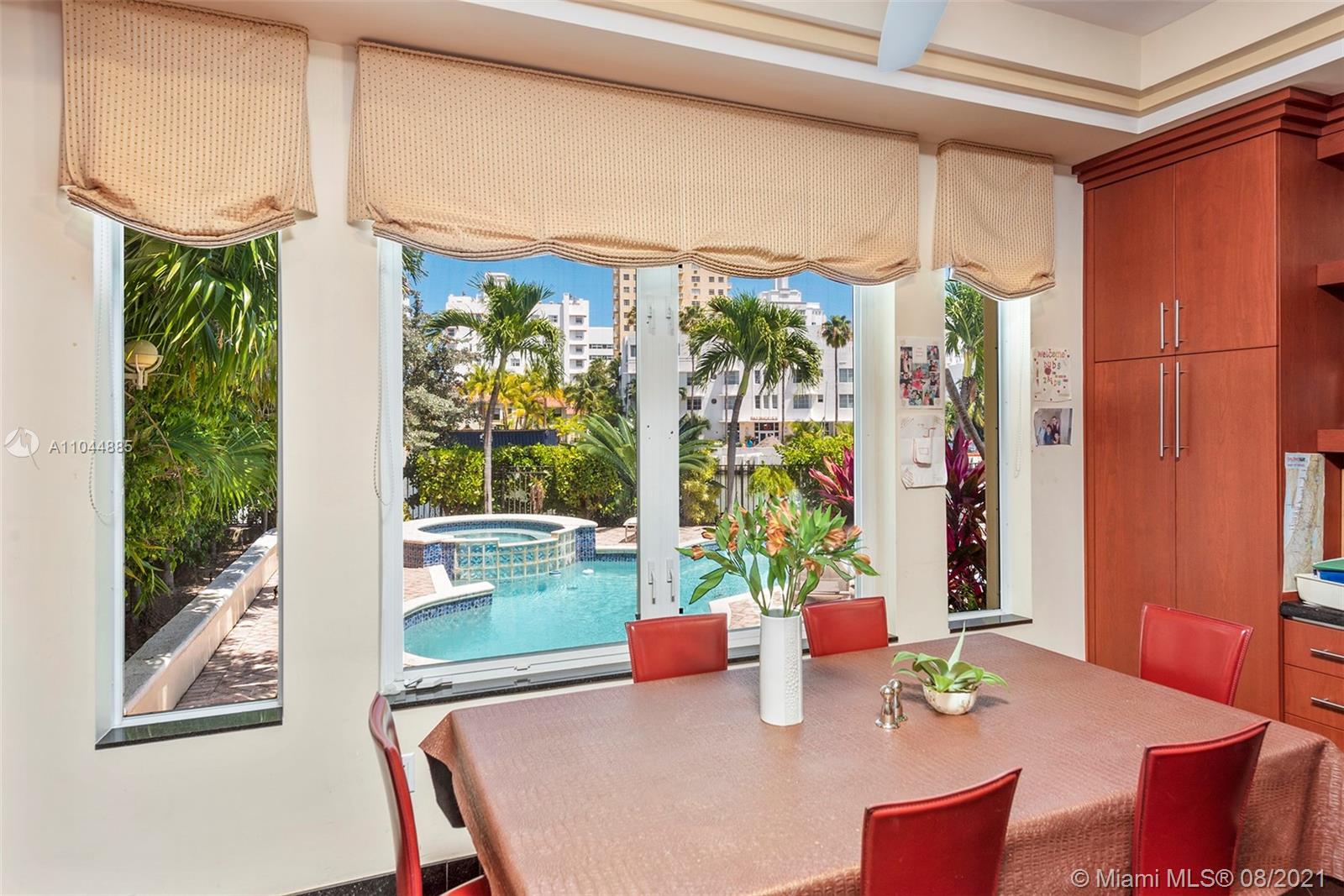 2995 Flamingo Drive Miami Beach, FL 33140 - Photo 30 of 54 a outdoor dining space with furniture and garden view