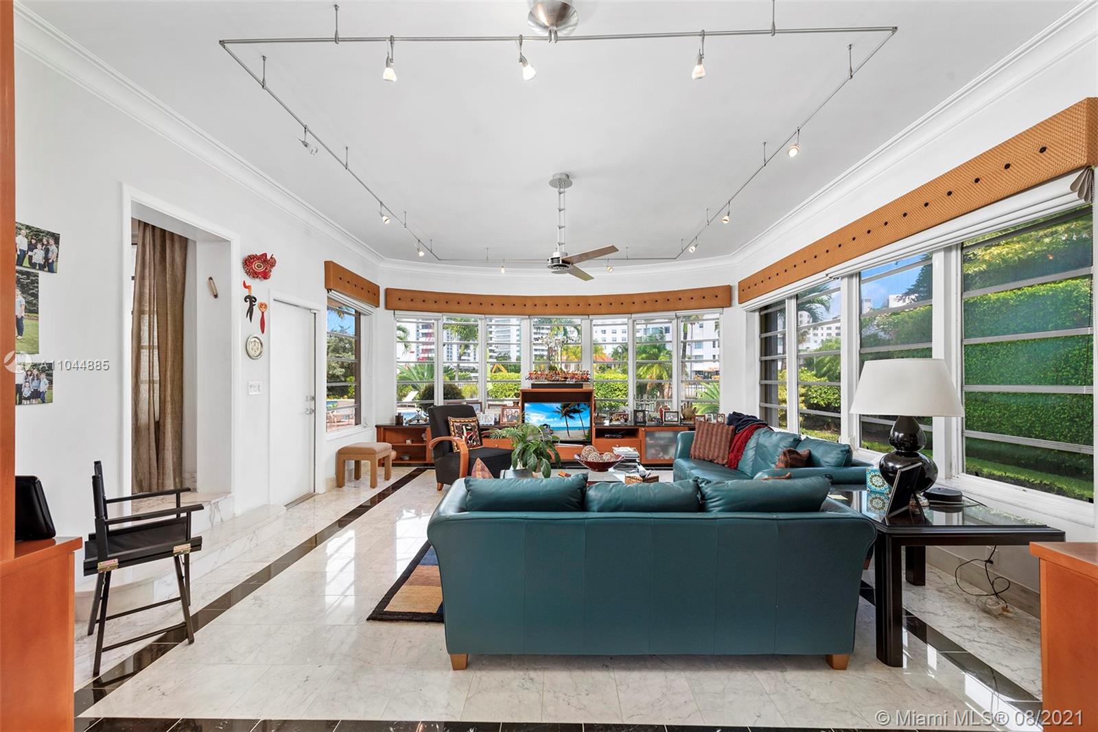 2995 Flamingo Drive Miami Beach, FL 33140 - Photo 34 of 54 a living room with furniture a window and a flat screen tv