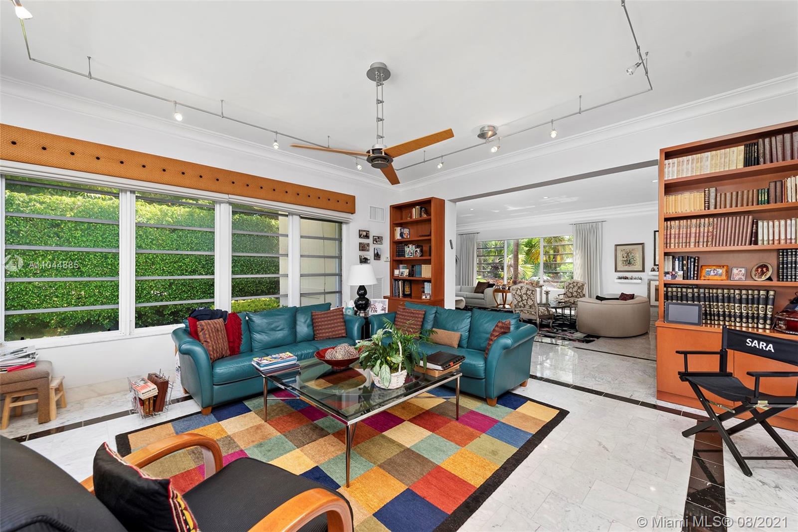 2995 Flamingo Drive Miami Beach, FL 33140 - Photo 35 of 54 a living room with furniture a rug and a large window