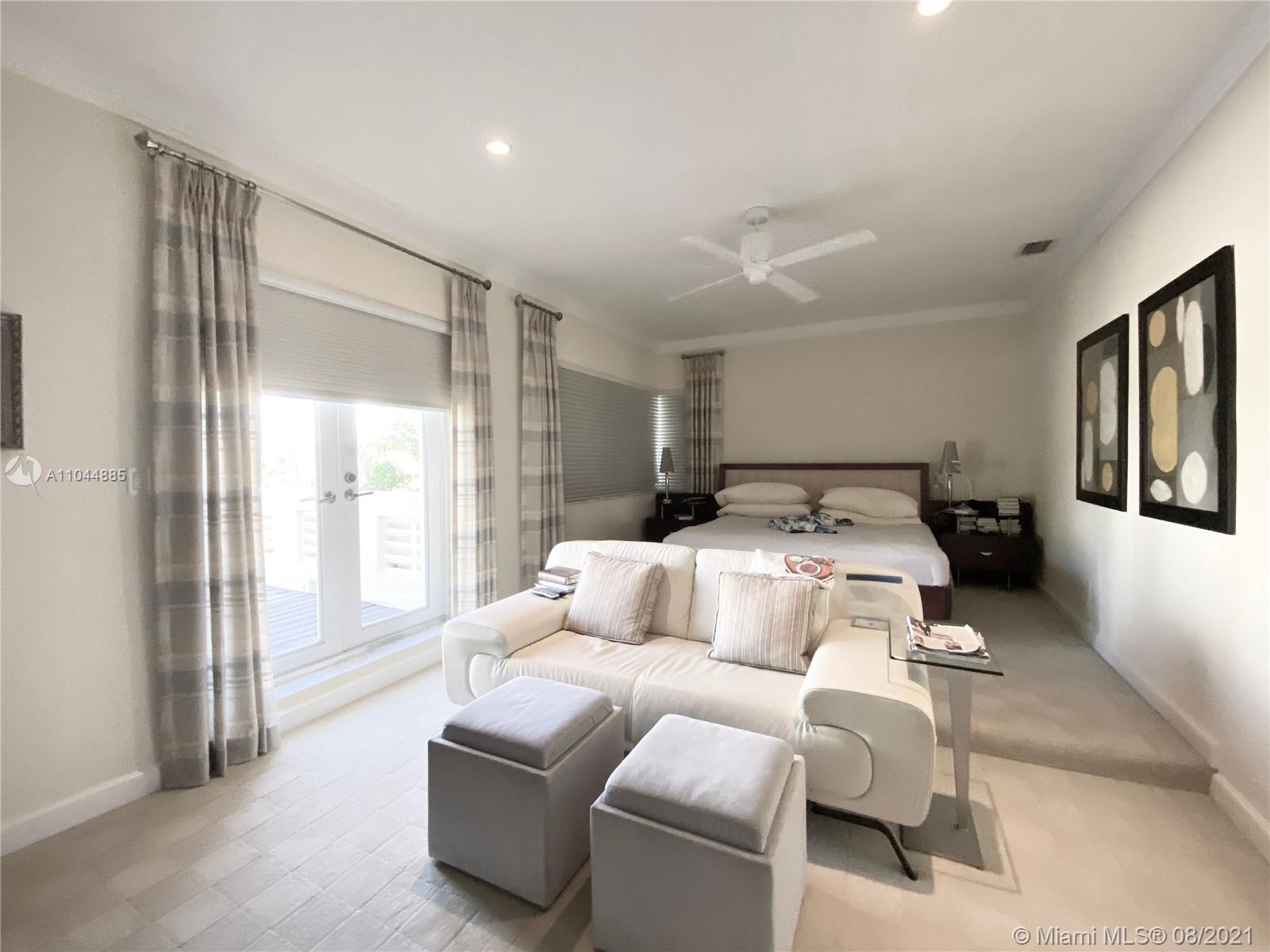 2995 Flamingo Drive Miami Beach, FL 33140 - Photo 38 of 54 a bedroom with furniture and a large window