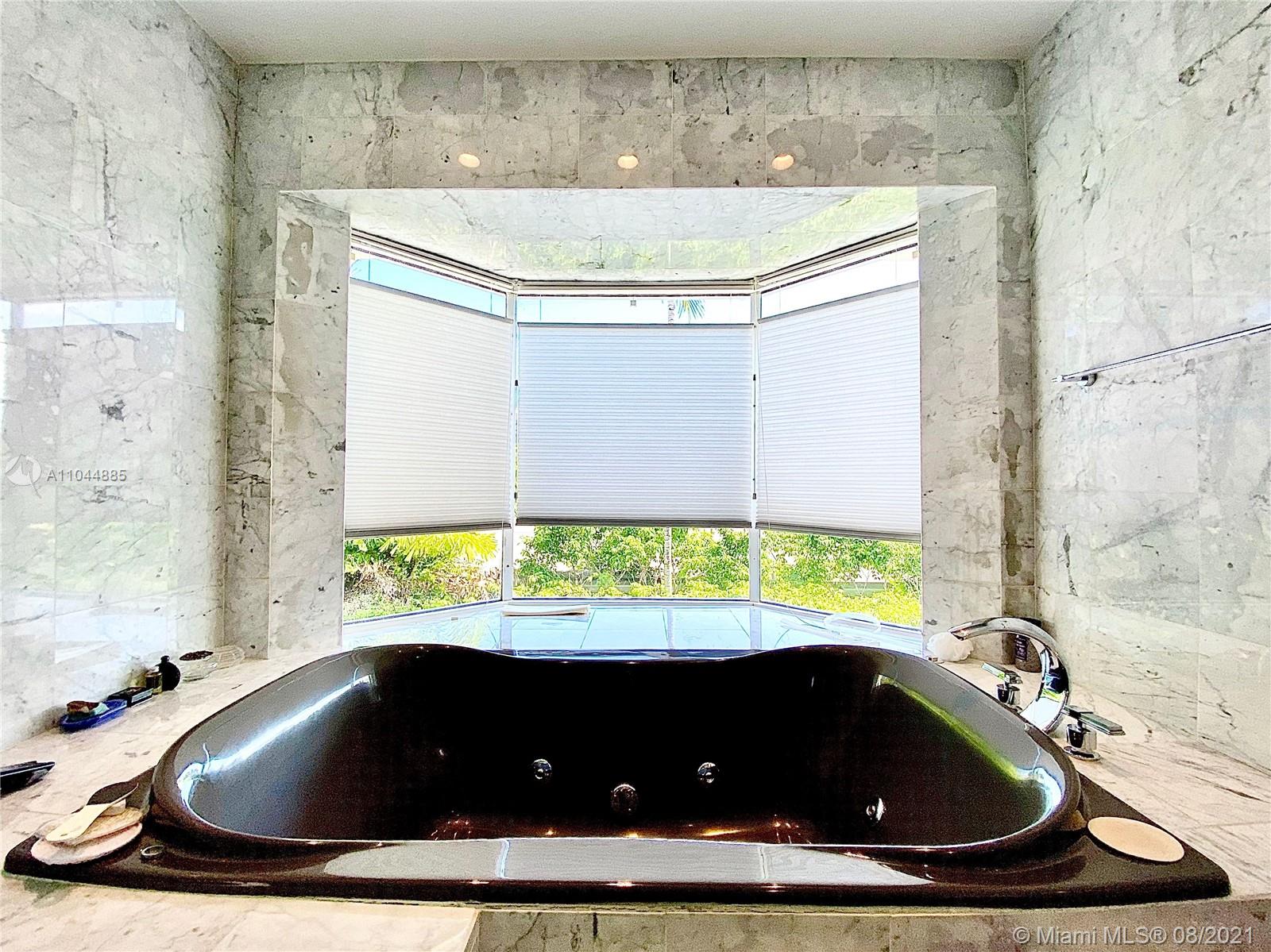 2995 Flamingo Drive Miami Beach, FL 33140 - Photo 40 of 54 a kitchen with a sink and window