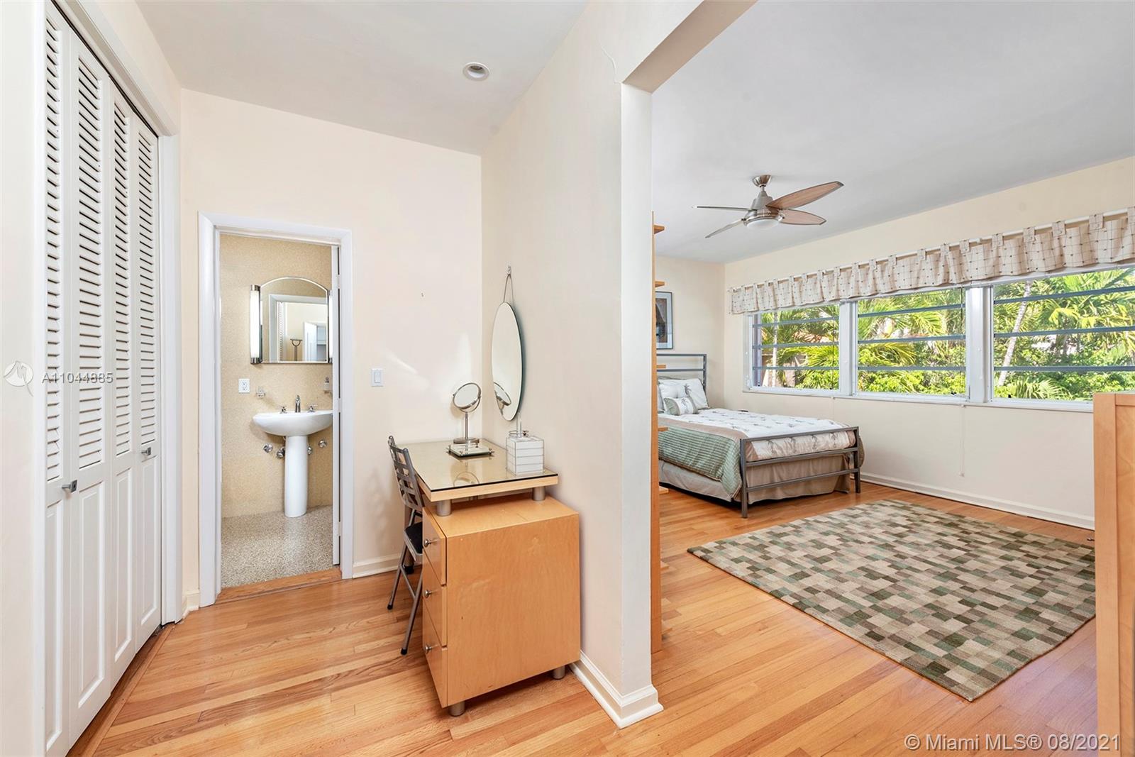 2995 Flamingo Drive Miami Beach, FL 33140 - Photo 43 of 54 a living room with furniture and a window
