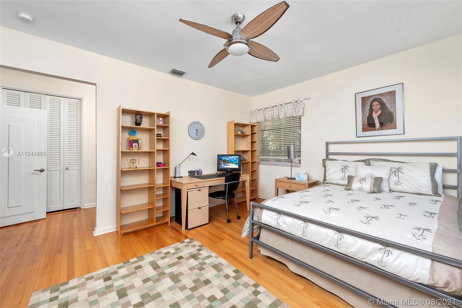 2995 Flamingo Drive Miami Beach, FL 33140 - Photo 44 of 54 a bedroom with a bed and a dresser in it