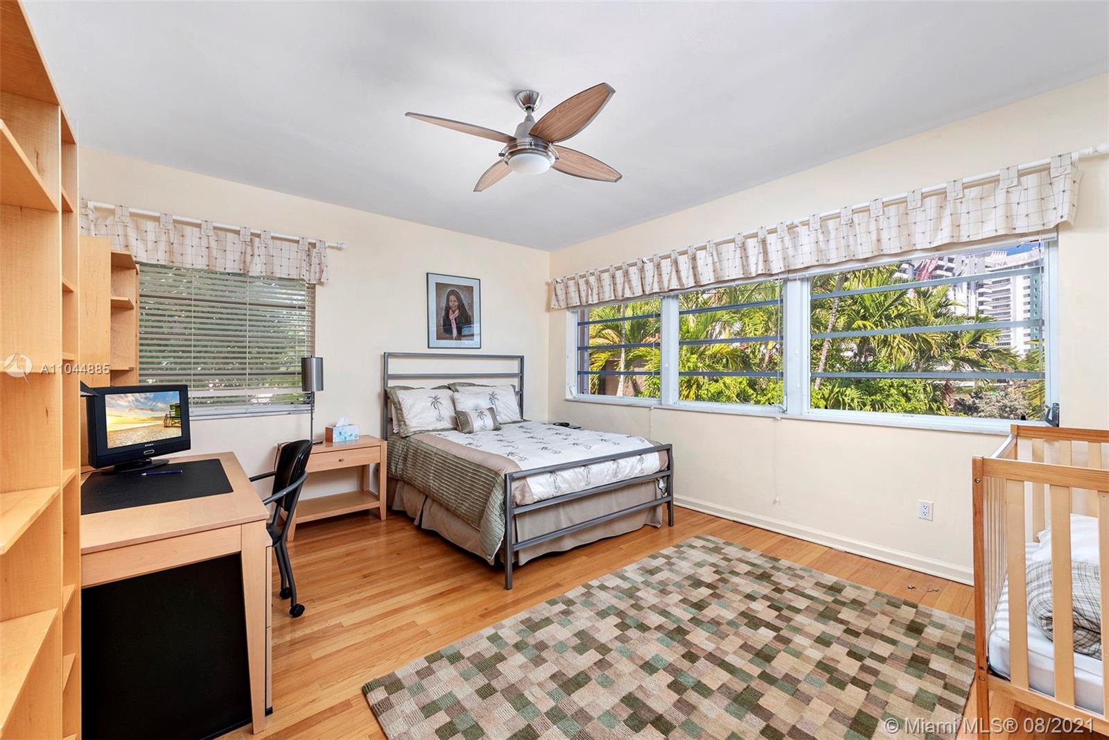 2995 Flamingo Drive Miami Beach, FL 33140 - Photo 45 of 54 a living room with furniture and a fireplace