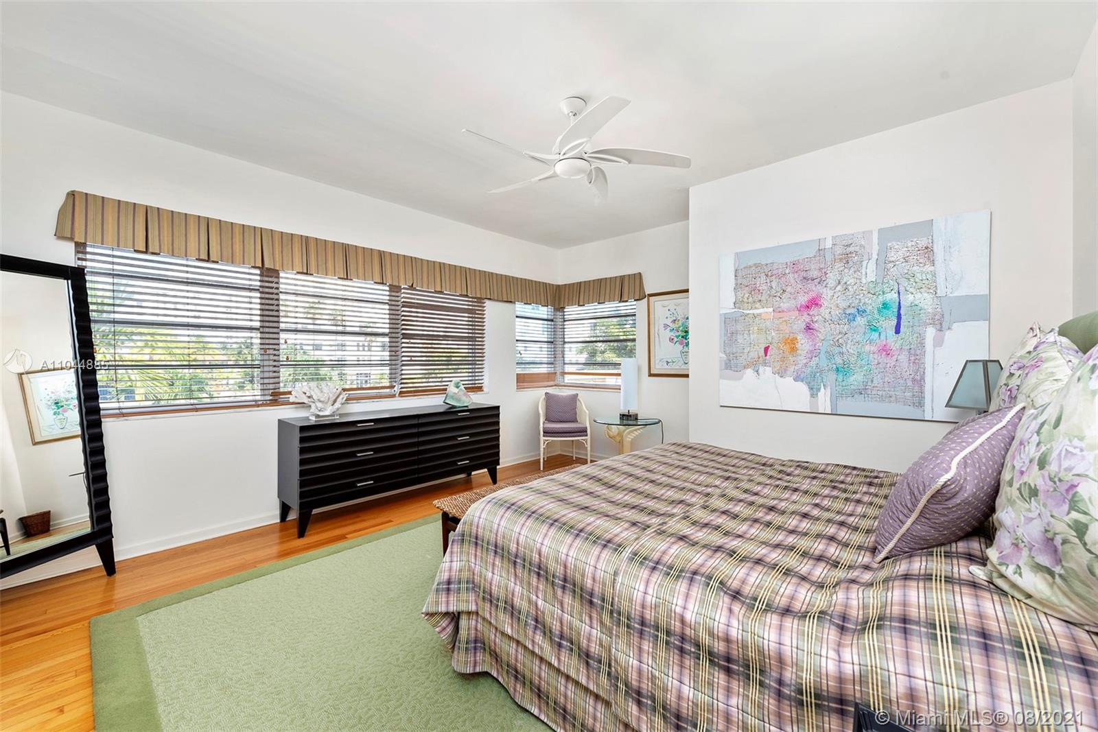 2995 Flamingo Drive Miami Beach, FL 33140 - Photo 46 of 54 a bedroom with a bed and a large window