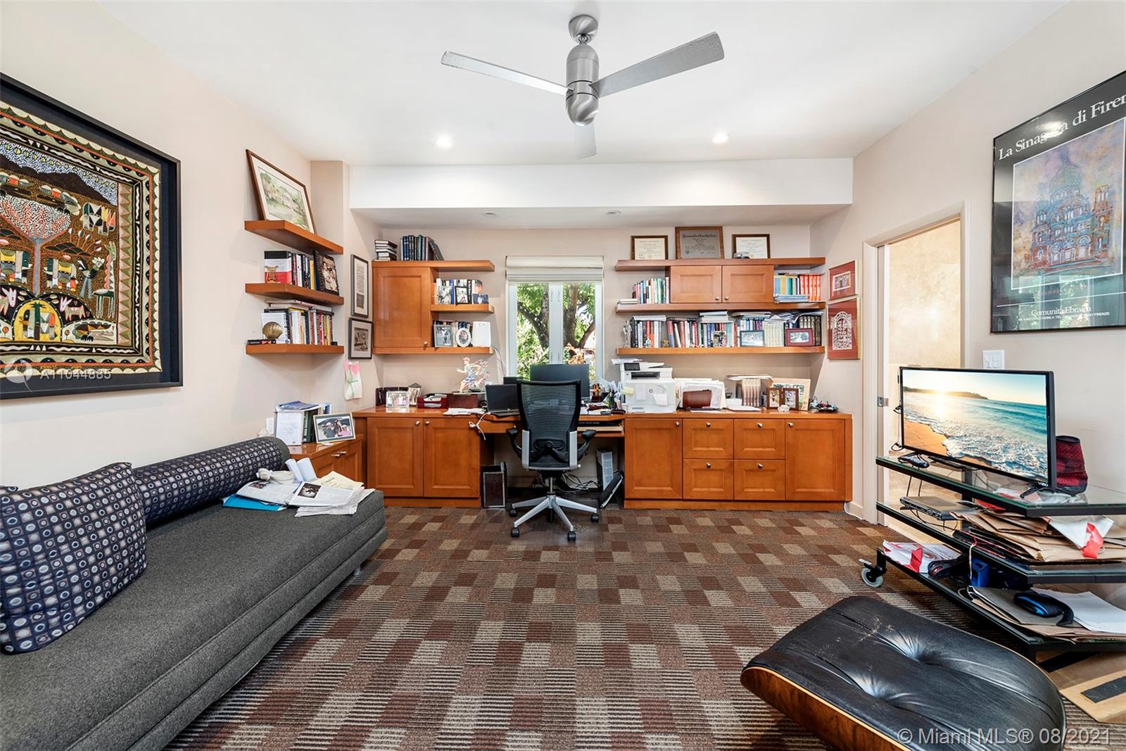 2995 Flamingo Drive Miami Beach, FL 33140 - Photo 49 of 54 a room with furniture gym equipment and a window