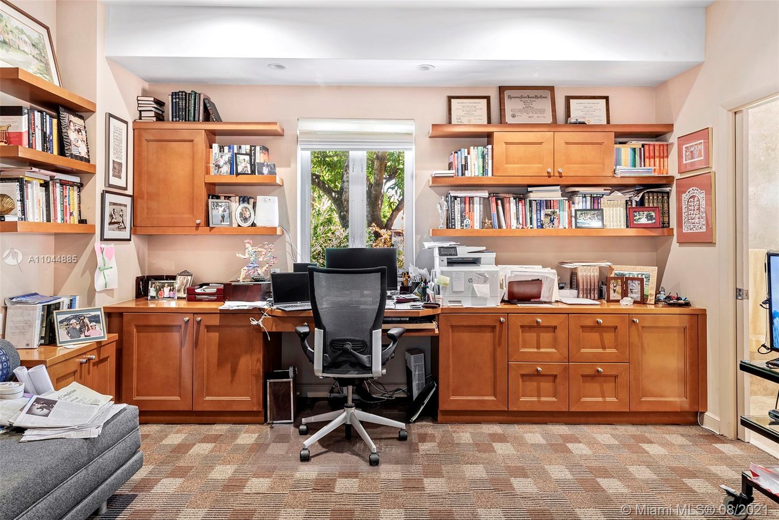 2995 Flamingo Drive Miami Beach, FL 33140 - Photo 50 of 54 a work place with a large window and a book shelf