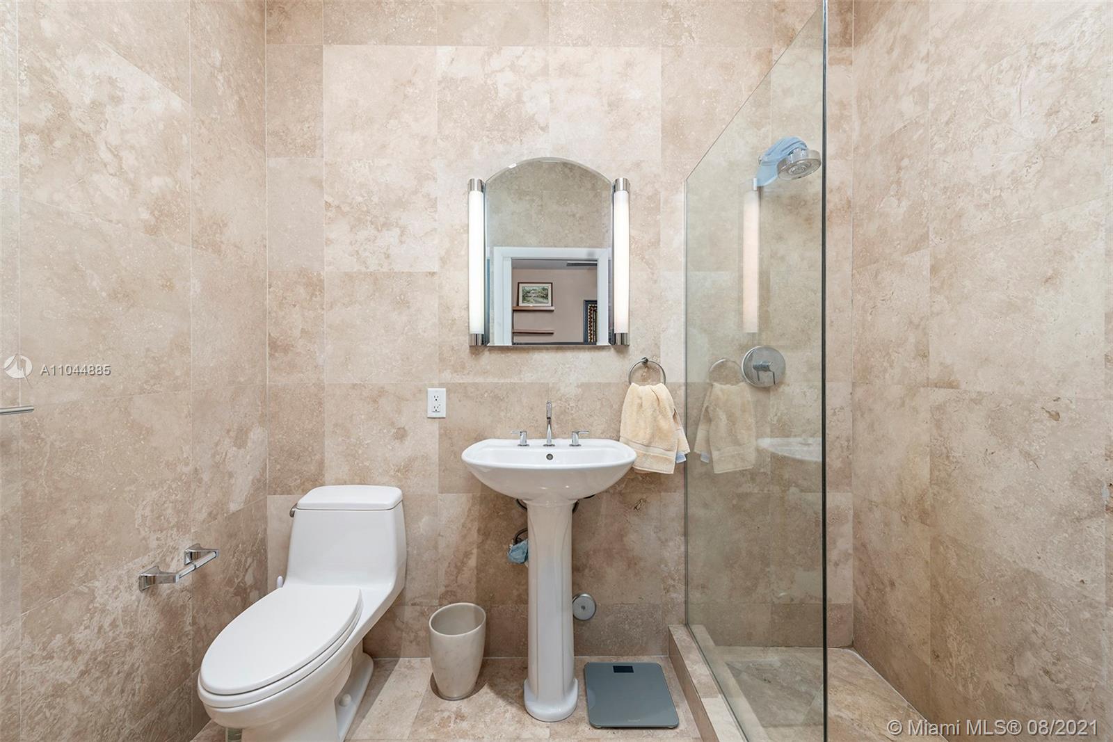 2995 Flamingo Drive Miami Beach, FL 33140 - Photo 52 of 54 a bathroom with a toilet sink and shower