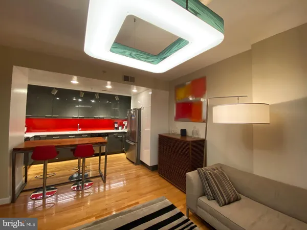 a room with furniture pool table and a projector screen