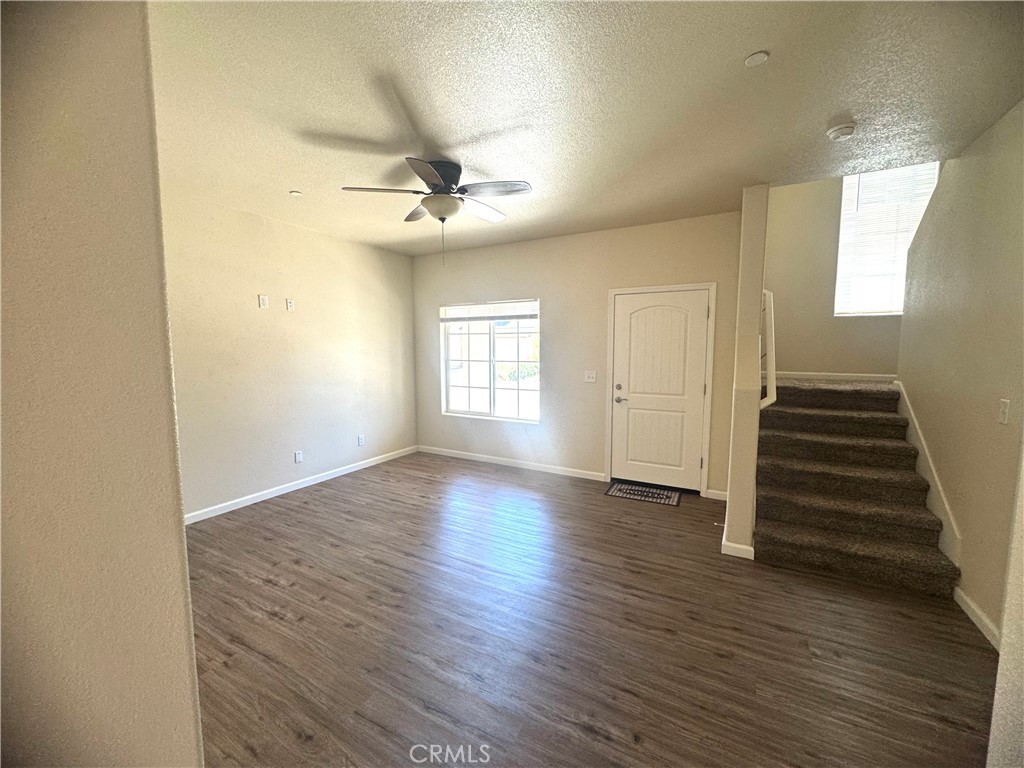 1339 Playa Del Rey Drive Merced, CA 95348 - Photo 4 of 48 wooden floor in an empty room with a window