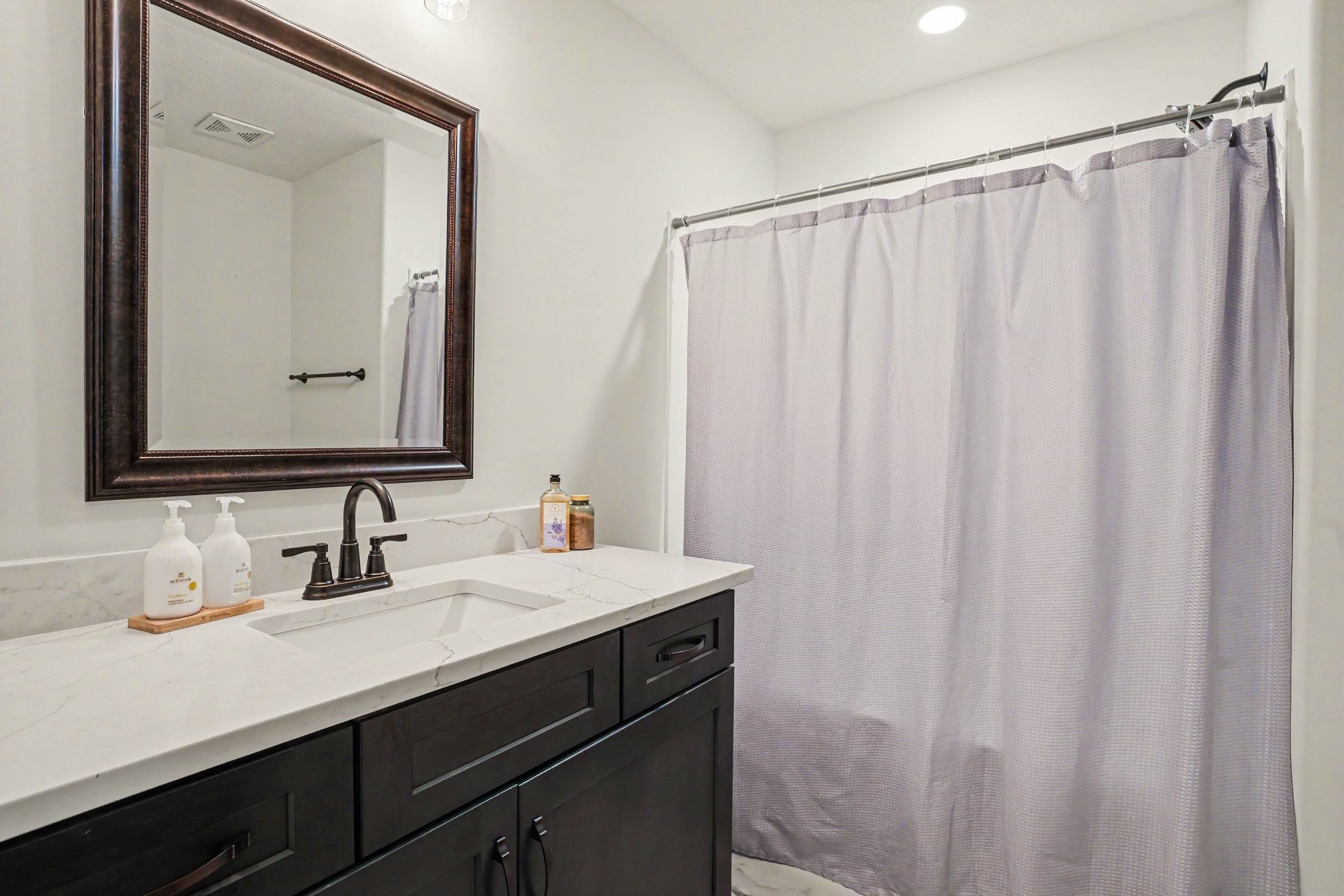 1415 Southside Road Southside, TN 37171 - Photo 20 of 35 a bathroom with a double vanity sink and a mirror