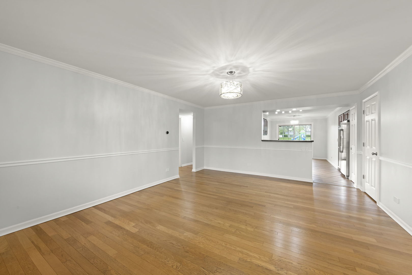 1338 South Lorraine Road, Unit D Wheaton, IL 60189 - Photo 2 of 23 a view of an empty room with a window
