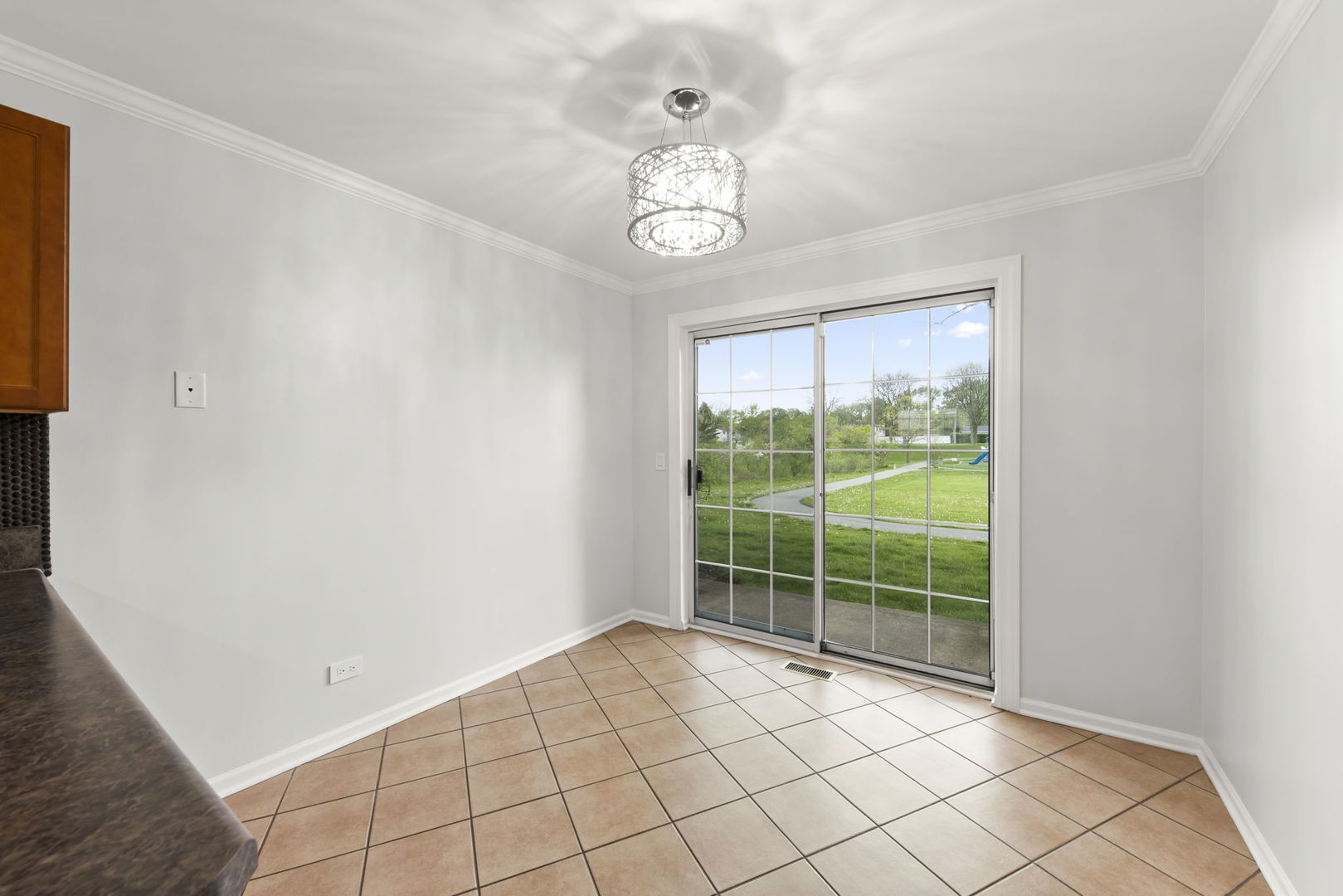 1338 South Lorraine Road, Unit D Wheaton, IL 60189 - Photo 10 of 23 a view of an empty room with a window