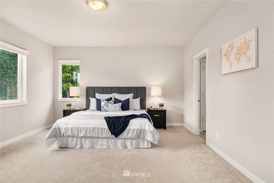 4024 Northeast 20th Street Renton, WA 98059 - Photo 14 of 27 a bedroom with a bed and a night stand