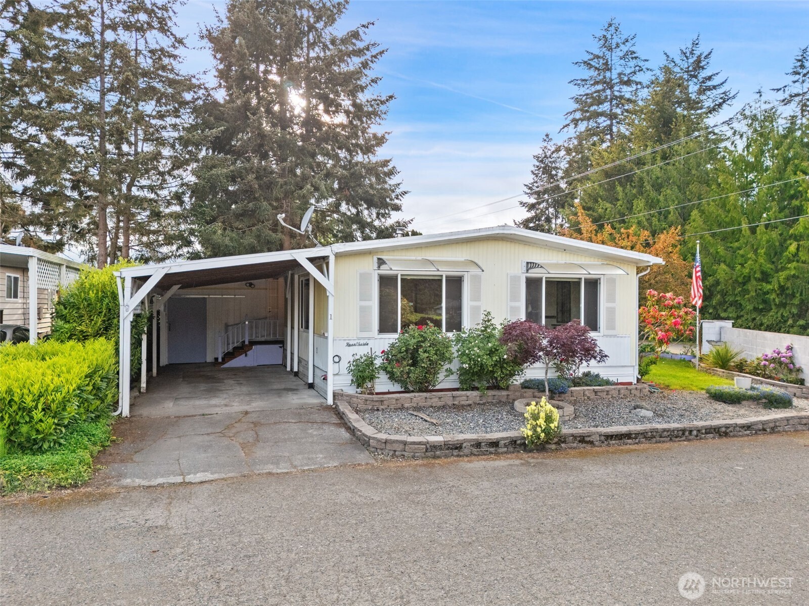 400 Gupster Road, Unit 1 Sequim, WA 98382 - Photo 1 of 39 a view of a house with backyard and garden