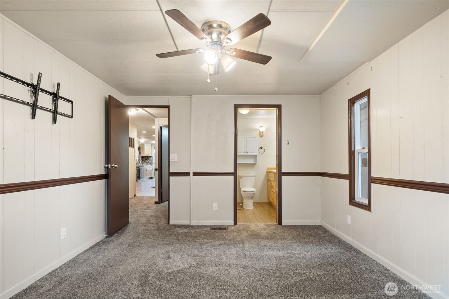 400 Gupster Road, Unit 1 Sequim, WA 98382 - Photo 22 of 39 a view of a kitchen with a refrigerator and a ceiling fan