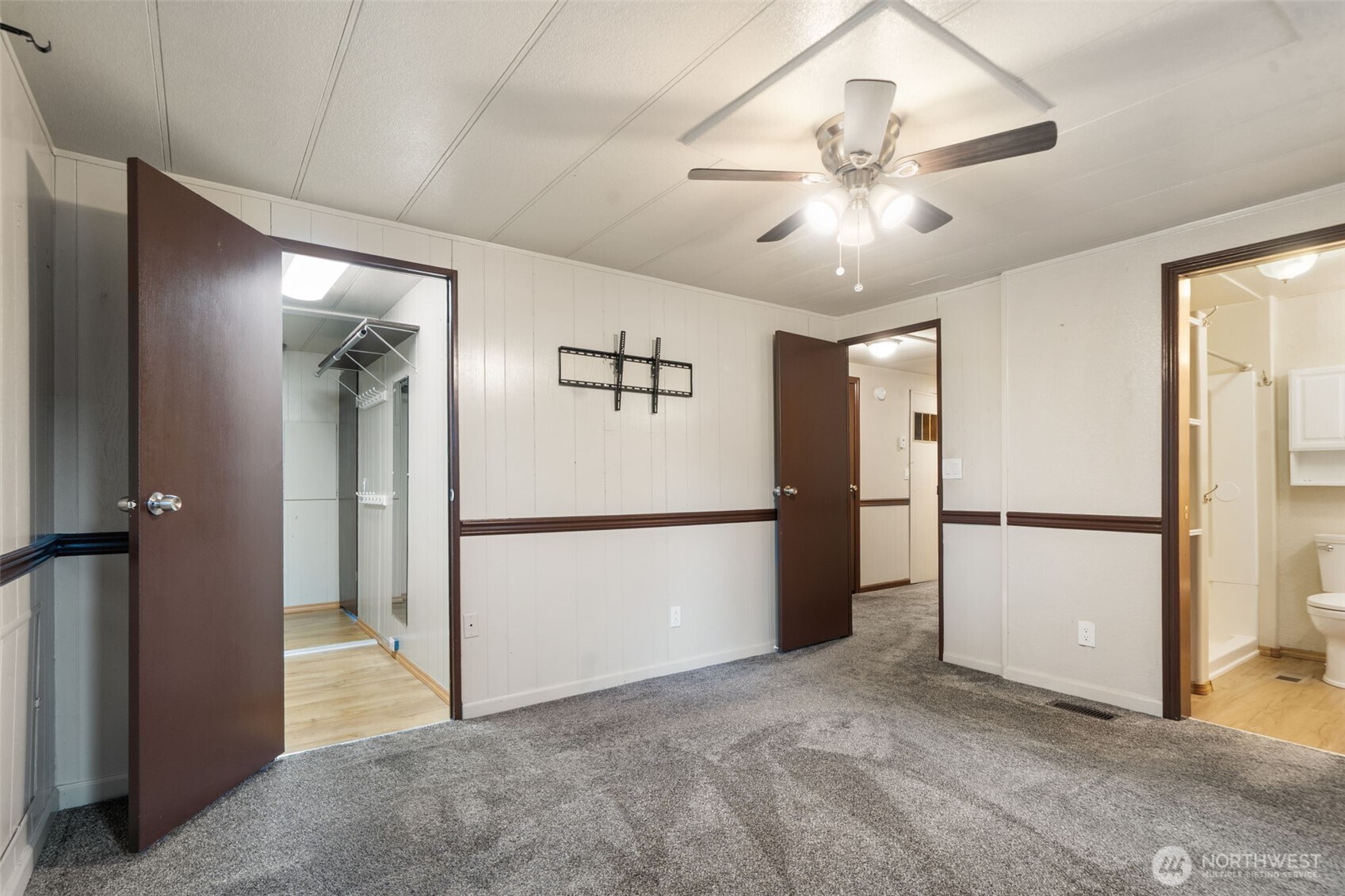 400 Gupster Road, Unit 1 Sequim, WA 98382 - Photo 23 of 39 a view of a kitchen with a refrigerator and a ceiling fan