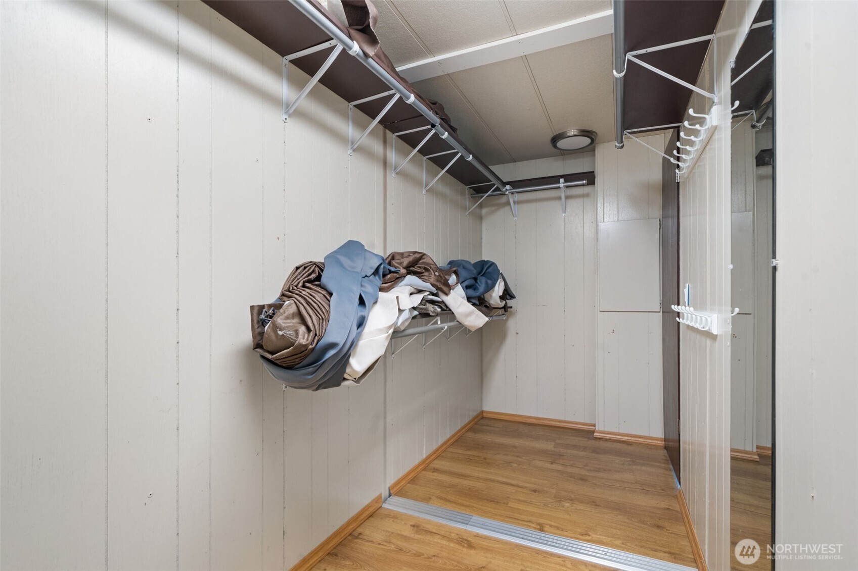 400 Gupster Road, Unit 1 Sequim, WA 98382 - Photo 24 of 39 a view of walk in closet with clothes and shoes
