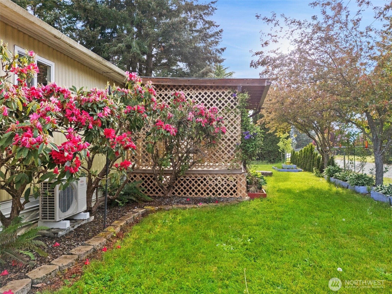 400 Gupster Road, Unit 1 Sequim, WA 98382 - Photo 32 of 39 a view of a wooden house with a yard