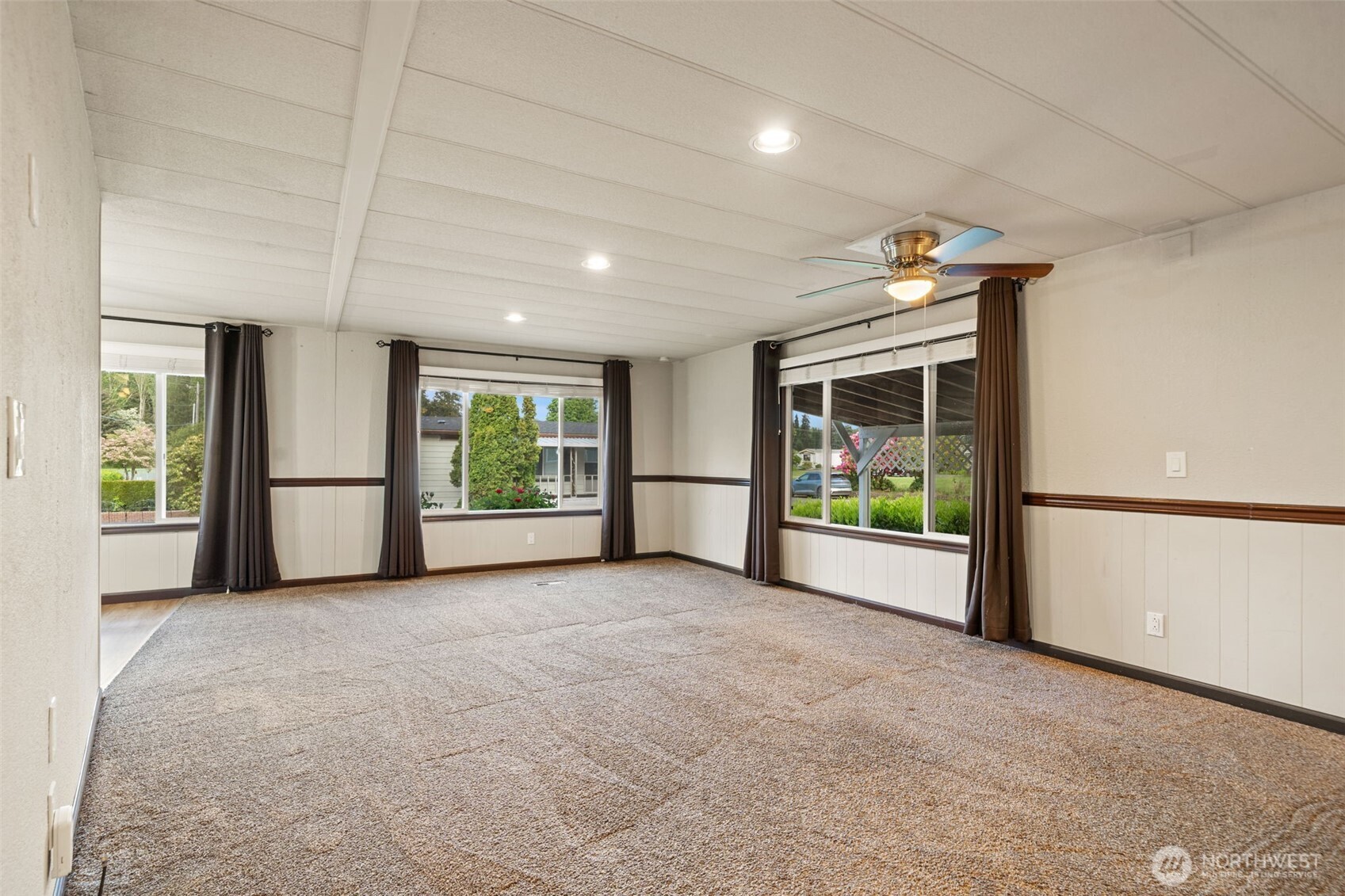 400 Gupster Road, Unit 1 Sequim, WA 98382 - Photo 5 of 39 a view of an empty room with a window and kitchen view