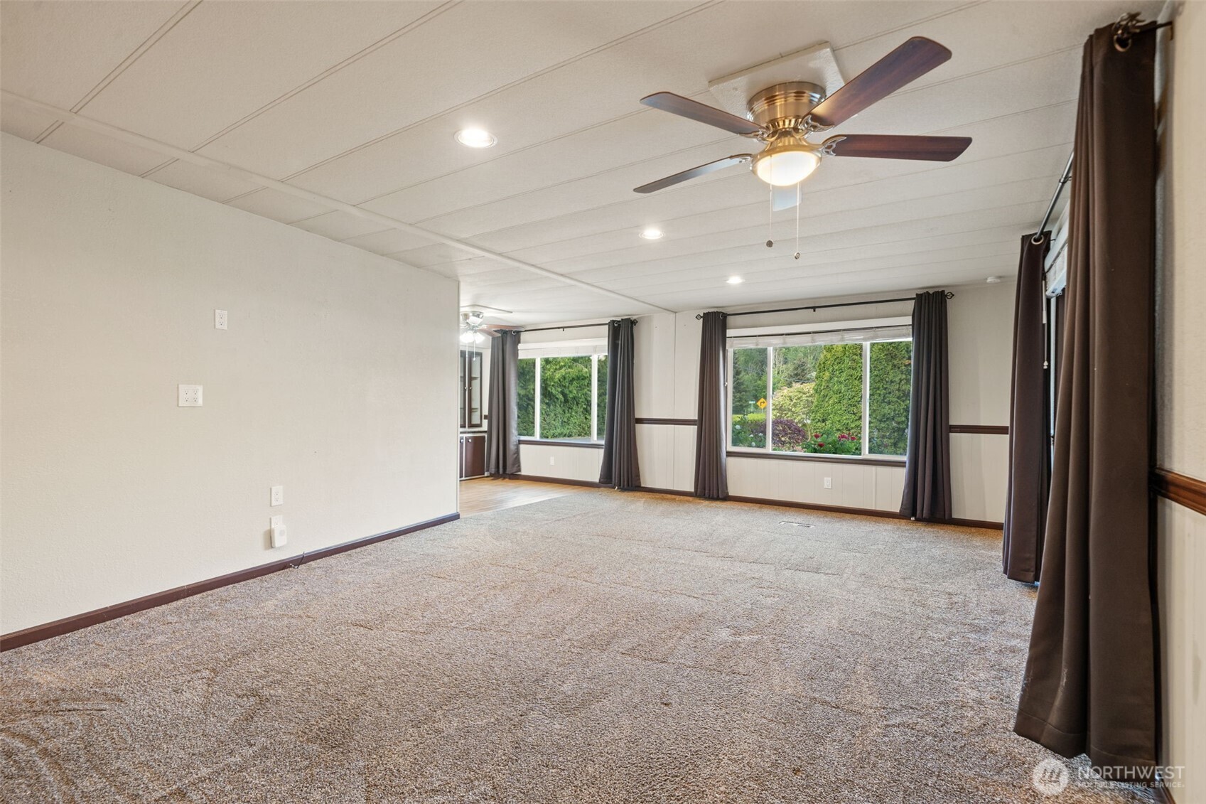 400 Gupster Road, Unit 1 Sequim, WA 98382 - Photo 6 of 39 an empty room with ceiling fan and window