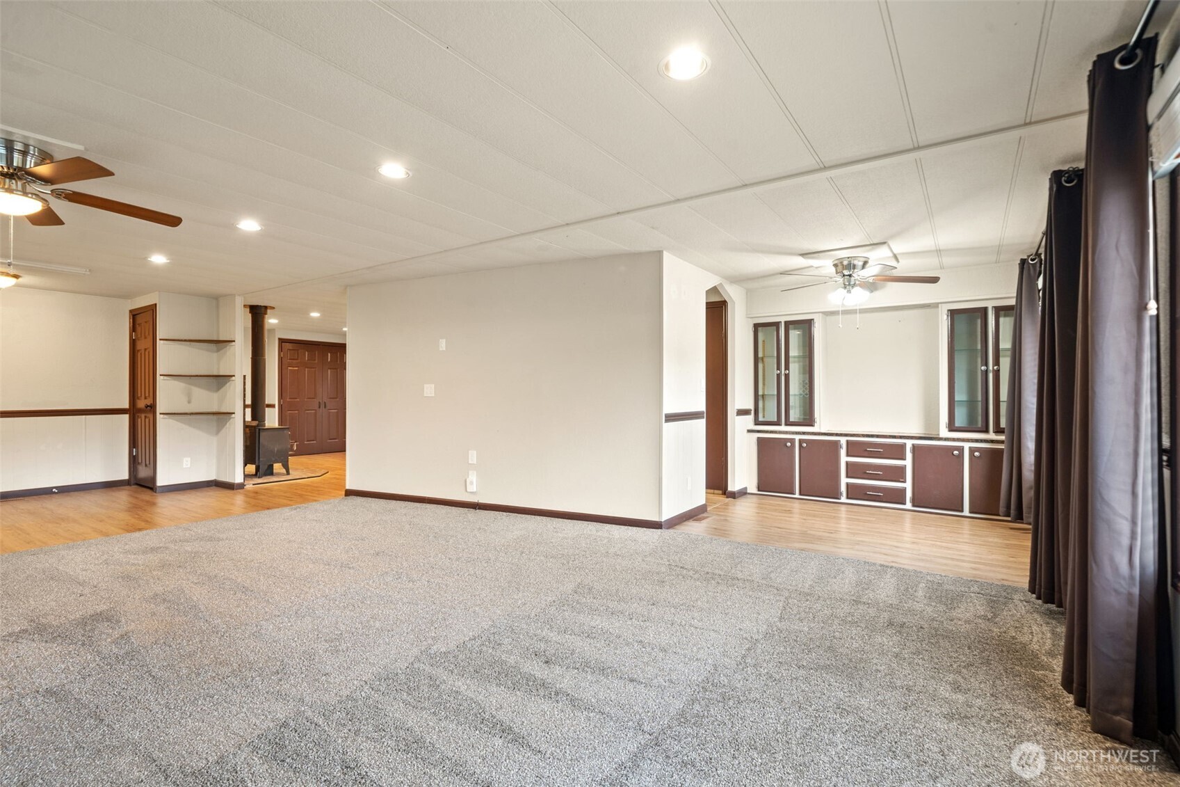 400 Gupster Road, Unit 1 Sequim, WA 98382 - Photo 8 of 39 an empty room with closet and mirrors
