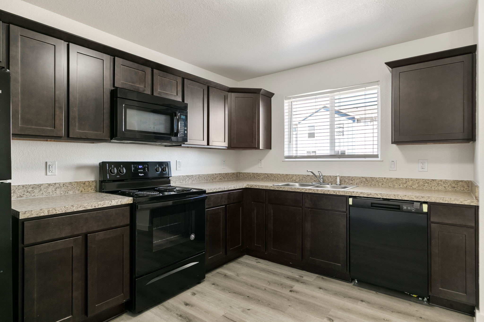 21155 Gosling Road, Unit 11B Spring, TX 77388 - Photo 1 of 27 a kitchen with granite countertop cabinets stainless steel appliances and a sink