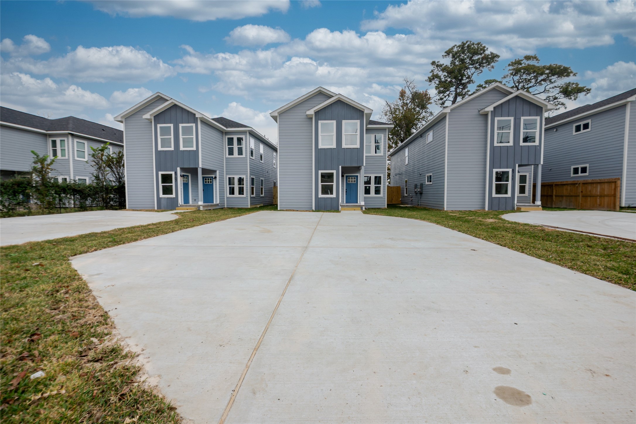 8707 Westcott Road, Unit A AND B Houston, TX 77016 - Photo 2 of 14 a front view of a building with a yard