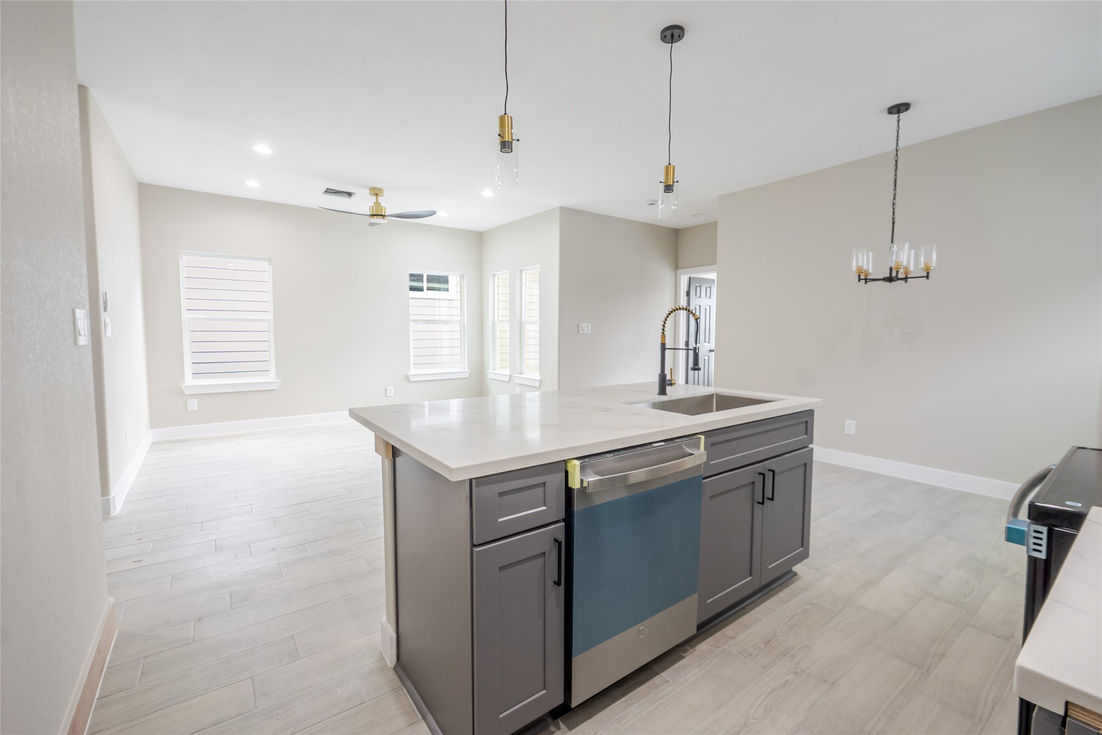 8707 Westcott Road, Unit A AND B Houston, TX 77016 - Photo 5 of 14 a kitchen with stainless steel appliances granite countertop a sink and a refrigerator