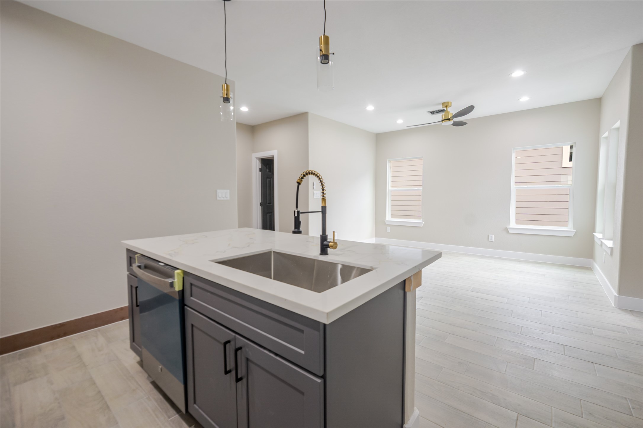 8707 Westcott Road, Unit A AND B Houston, TX 77016 - Photo 6 of 14 a kitchen with a sink and chandelier